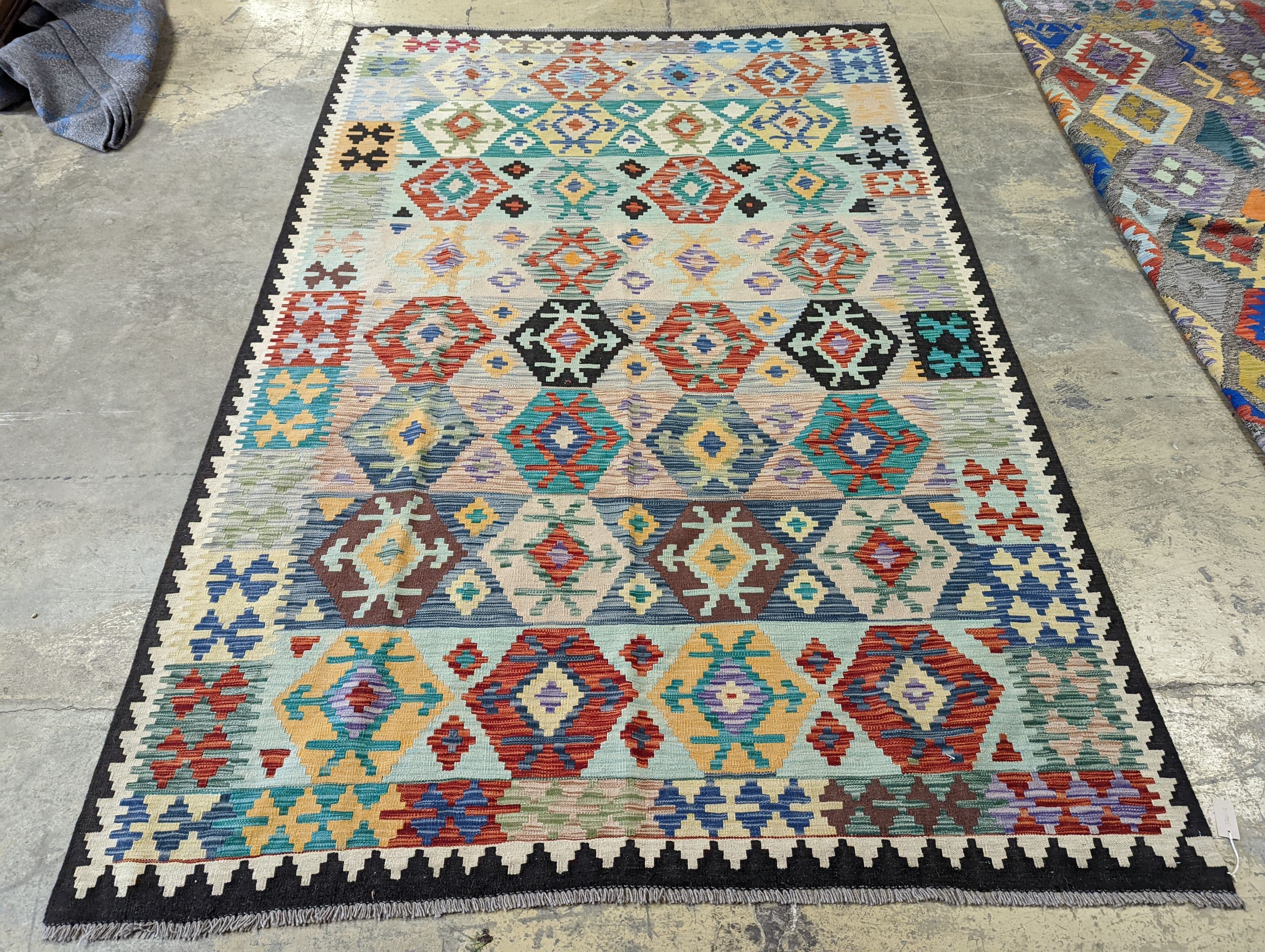 An Anatolian contemporary Kelim polychrome flatweave carpet, 300 x 204cm